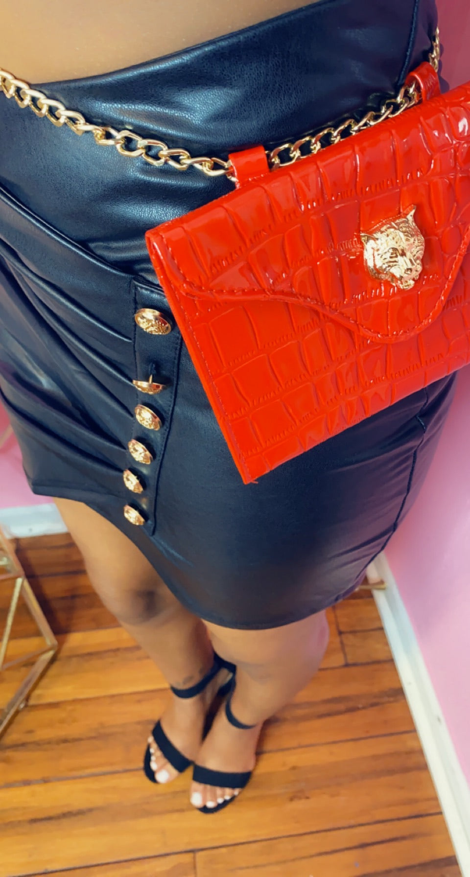 Faux leather mini skirt w/ gold button detail